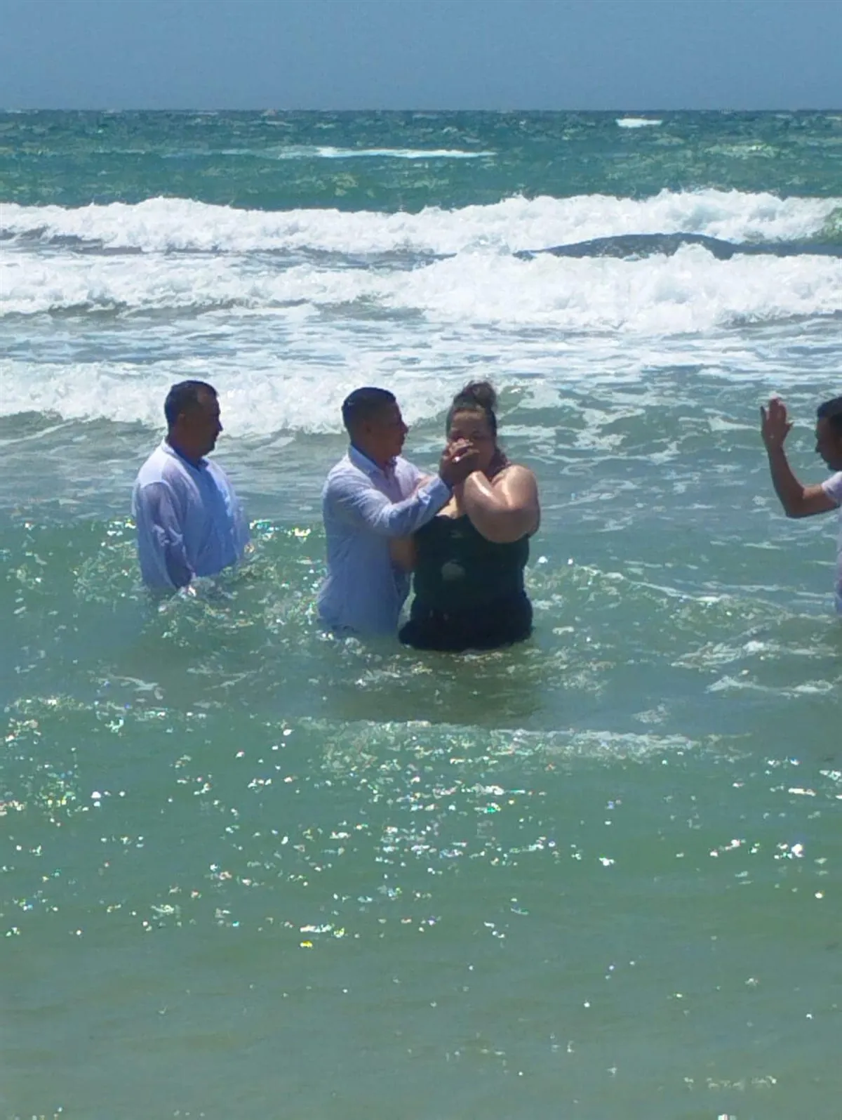 A baptism in the Sea of Cortez off the beach at Puerto Penasco, Mexico
