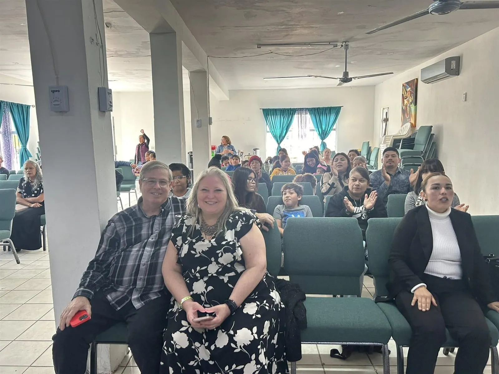 Visitors from the United States seated among the congregation during a Sunday service at Faith Family Church Rocky Point