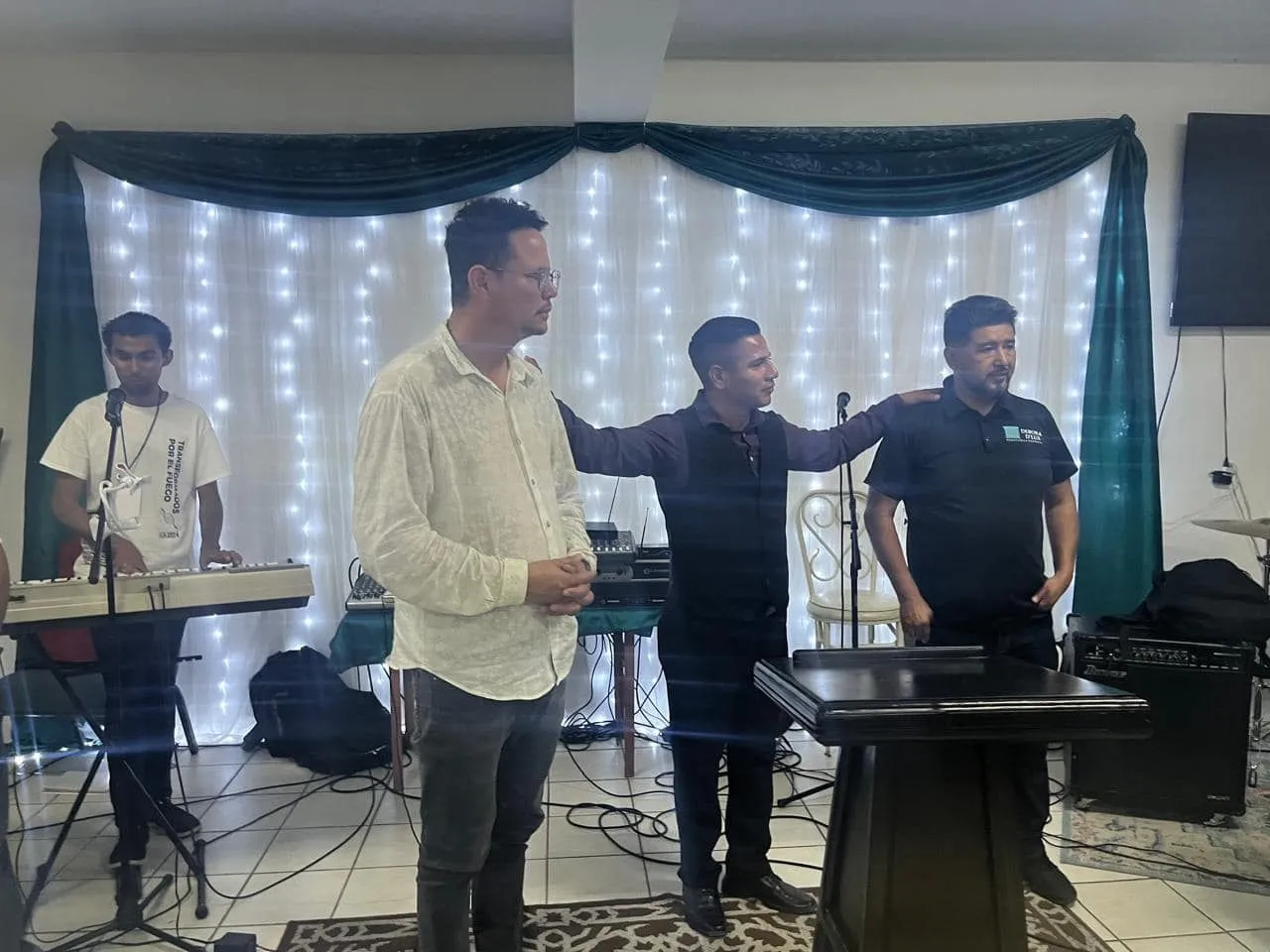 The worship team leading a service on the platform at Faith Family Church Rocky Point